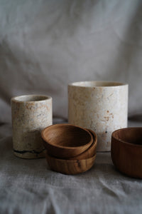 Grey polished marble holder for utensils, bathroom amenities or stationery. Paired here with our large marble holder and wooden bowls