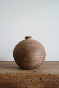 A textured clay vase with a brown matte finish that adds character to any space. Gorgeous on its own or paired with its mini version.