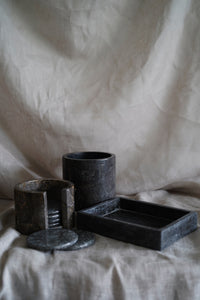 A polished grey marble tray. The perfect catchall for jewellery, keys and more. Paired here with our marble coasters and large holder